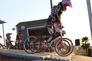 A group of determined BMX riders gearing up at sunrise, ready to start their journey across Florida.