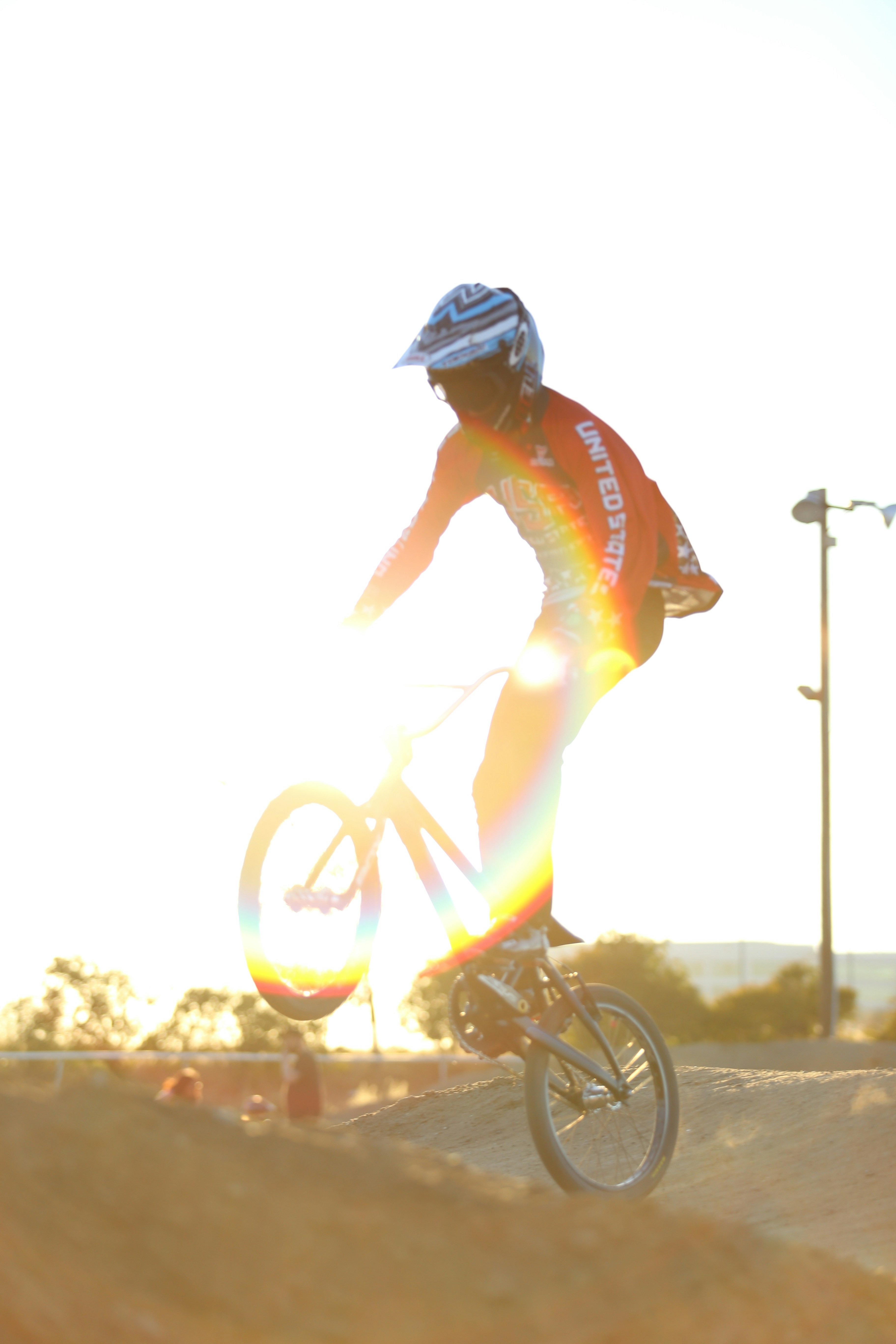 man in blue helmet riding bicycle during daytime