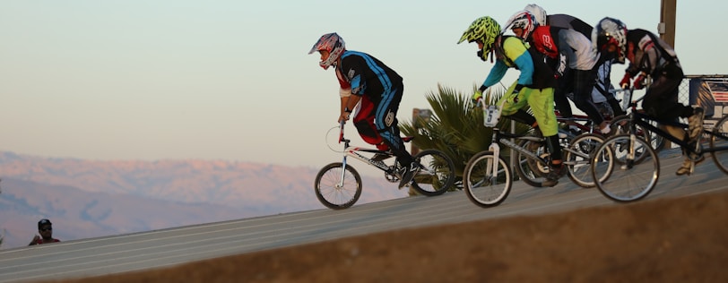 Children racing on the Big Bear Valley BMX track, helmets gleaming under the sun.