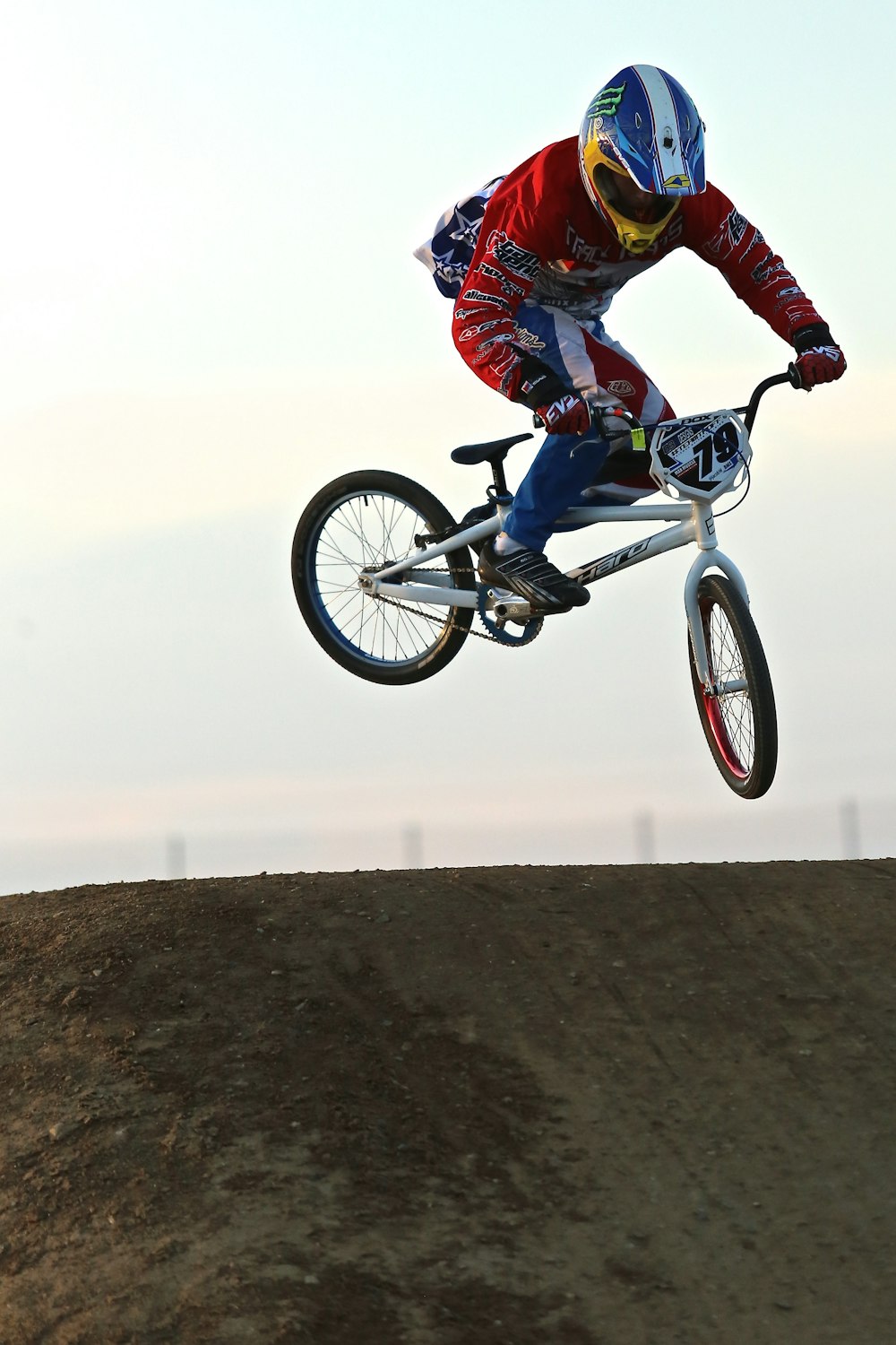 man in blue and black jacket riding on bicycle