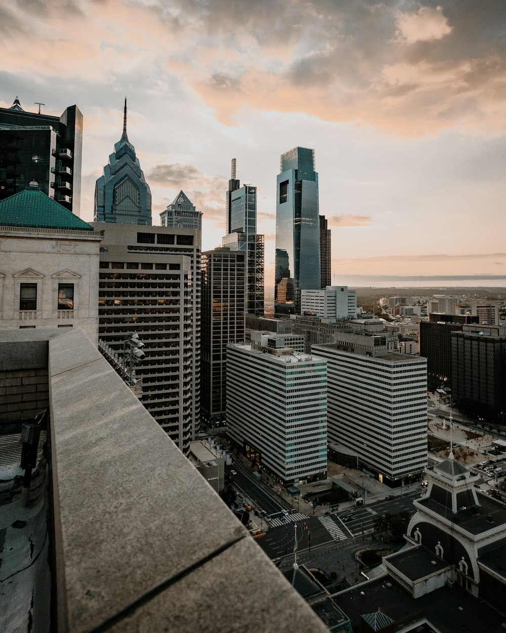 city skyline under white clouds during daytime