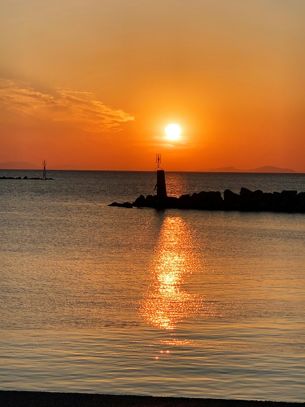 silhouette of lighthouse during sunset