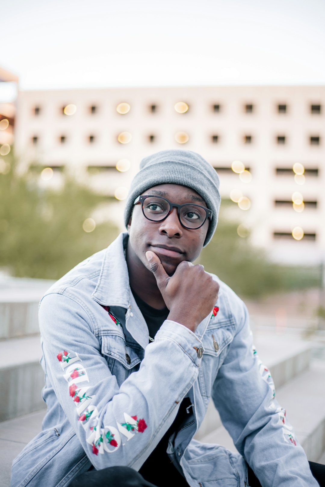 man in gray knit cap and blue denim jacket