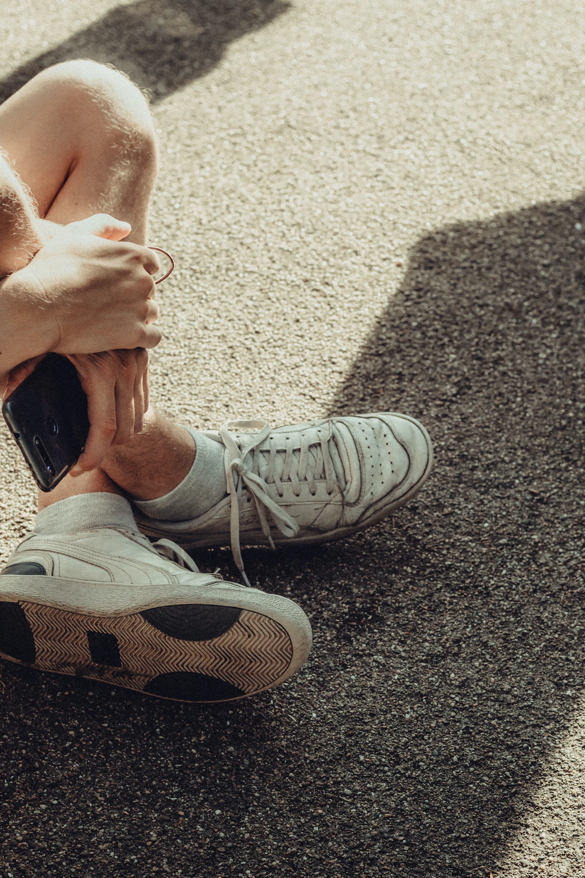Person in running shoes preparing to return to activity