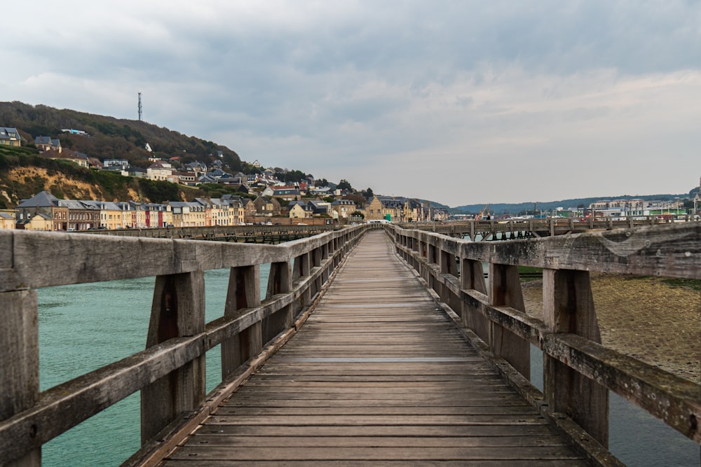 brown wooden dock on body of water during daytime