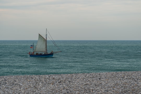 blue and brown sail boat on sea during daytime in Fécamp France