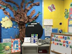 A cozy learning corner decorated with Islamic art and educational posters.