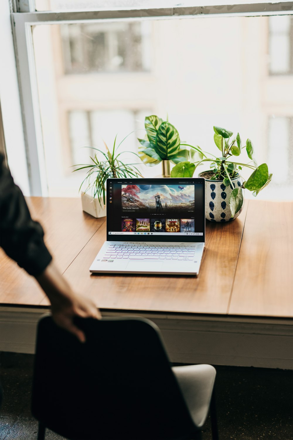 laptop on brown wooden table