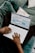 A professional client happily using a laptop to schedule an appointment online.