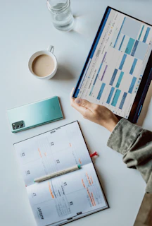 A virtual office setup with a calendar and legal documents on screen.
