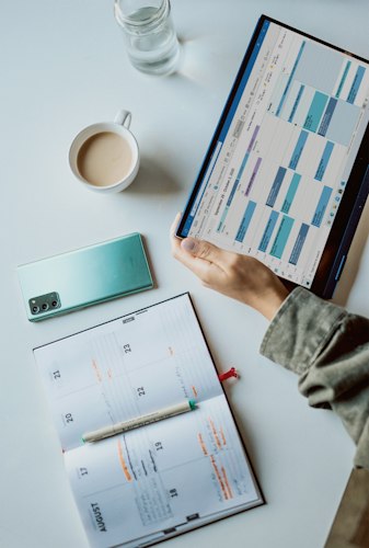 A frustrated professional looking at a smartphone showing a scheduling conflict