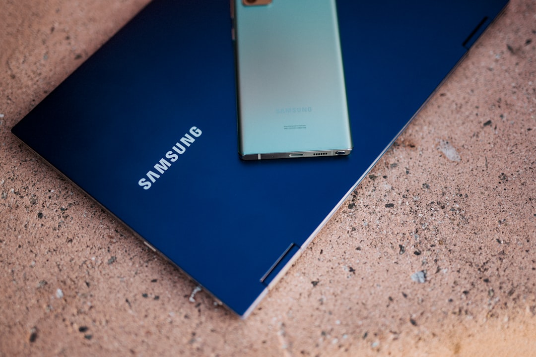 blue laptop on gray marble table