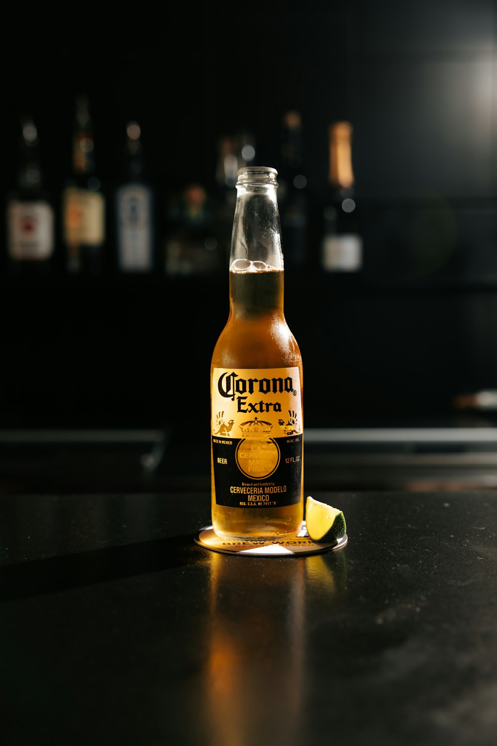corona extra beer bottle on black table