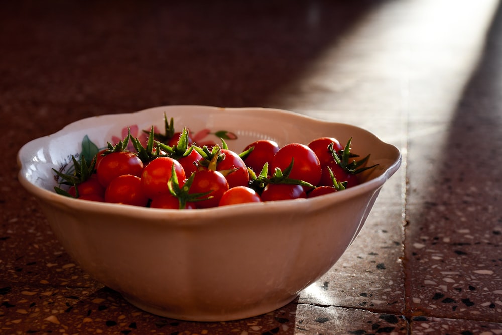 red cherry on white ceramic bowl