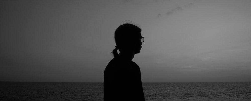 silhouette of a person wearing sunglasses