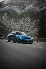 blue bmw m 3 on road during daytime