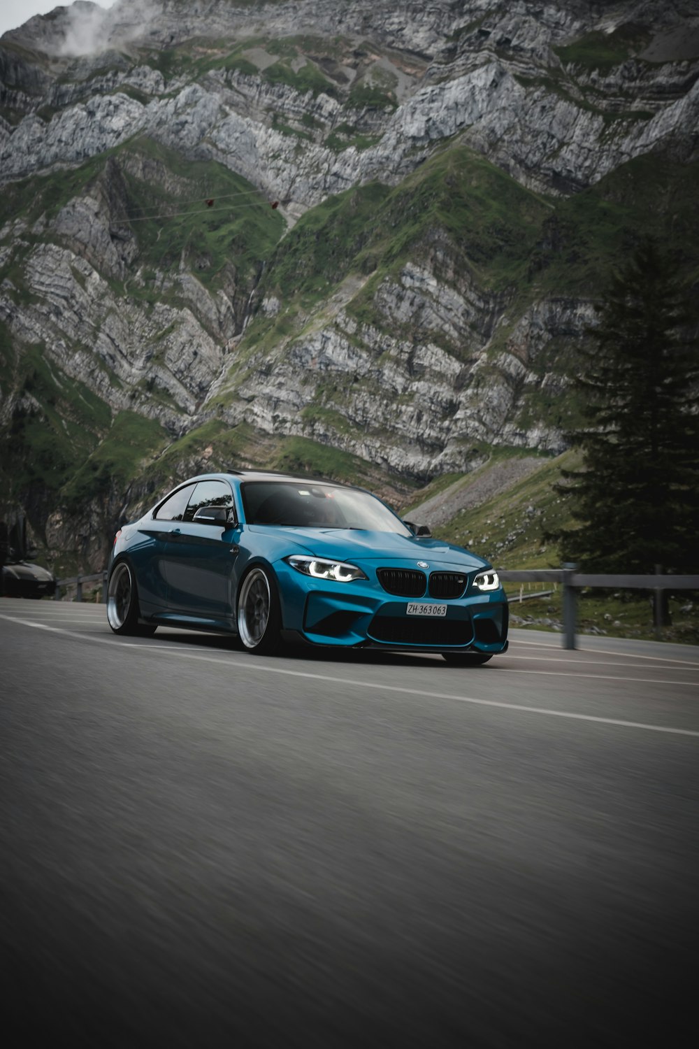 blue bmw m 3 on road during daytime