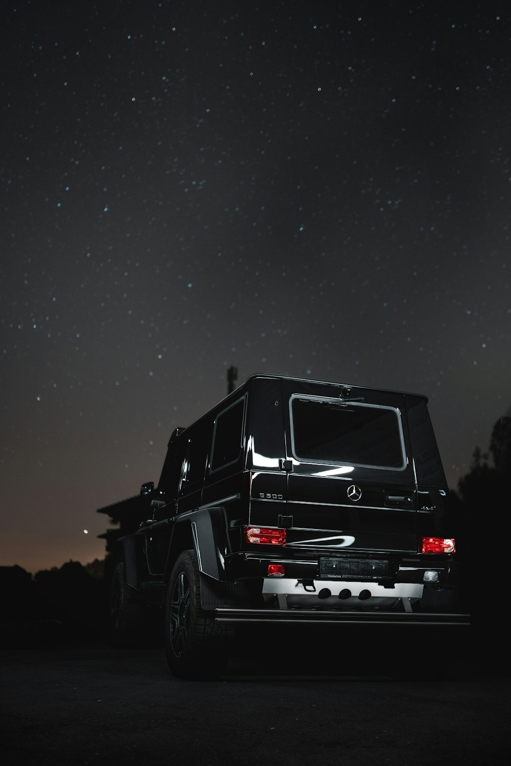 black suv on road during night time