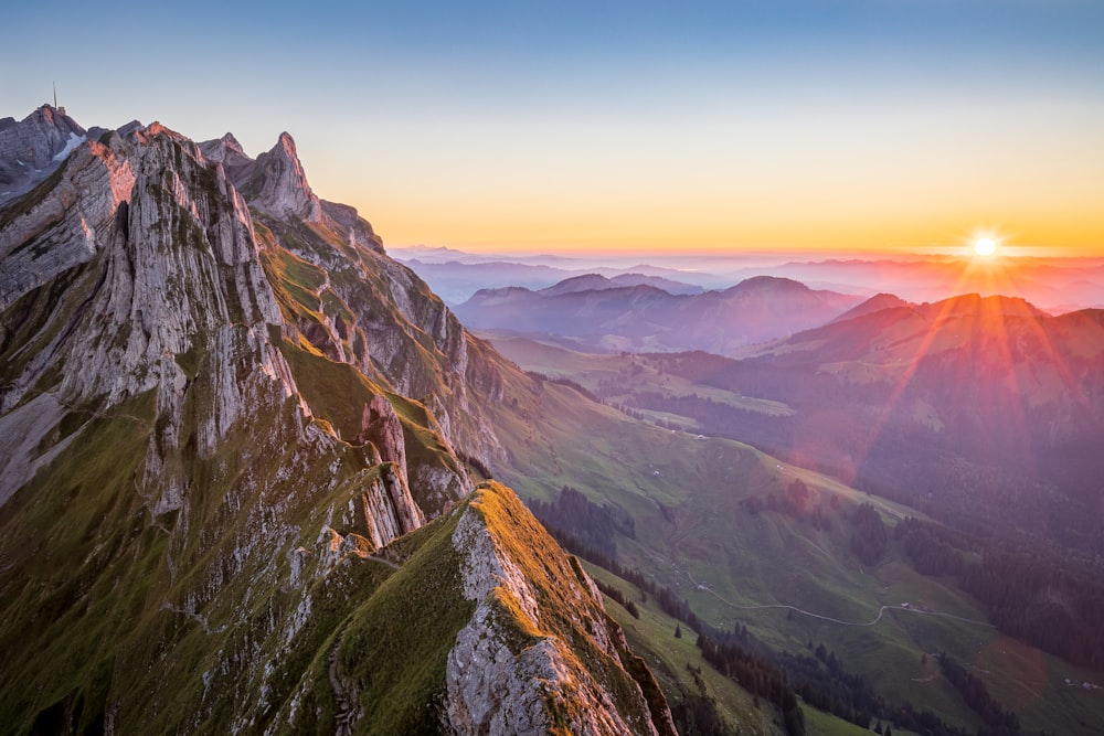 green and brown mountains under blue sky during daytime