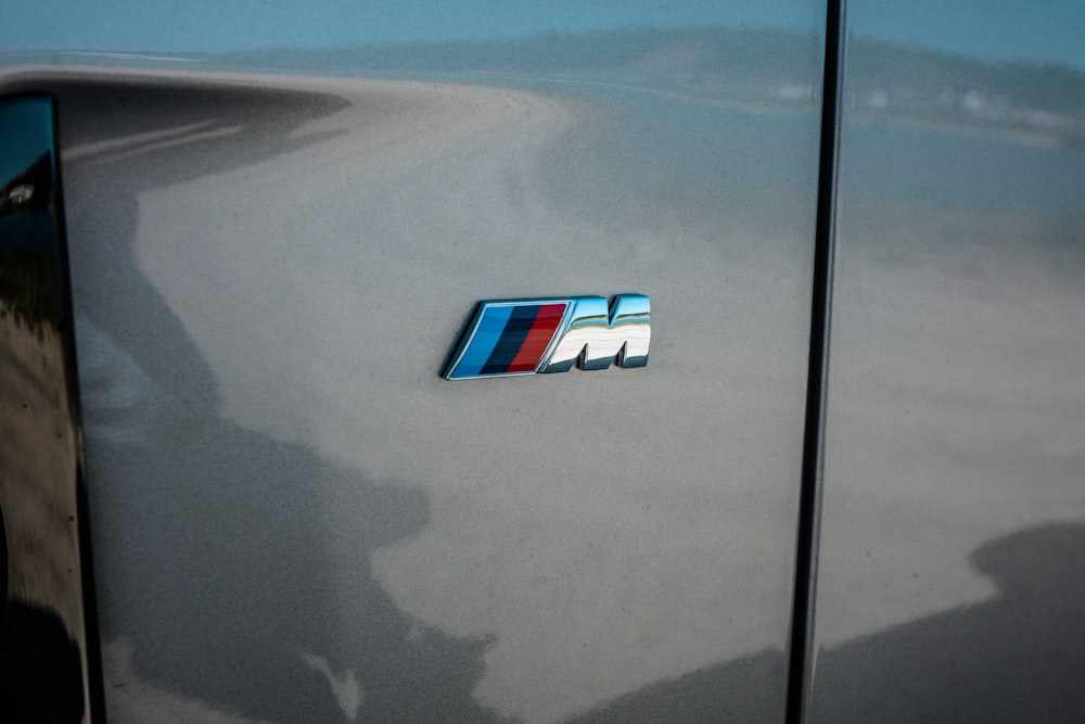 white and blue car on gray asphalt road