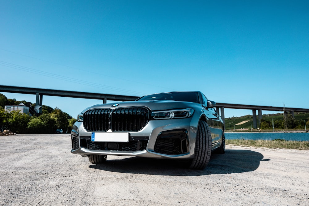 black car on gray sand during daytime