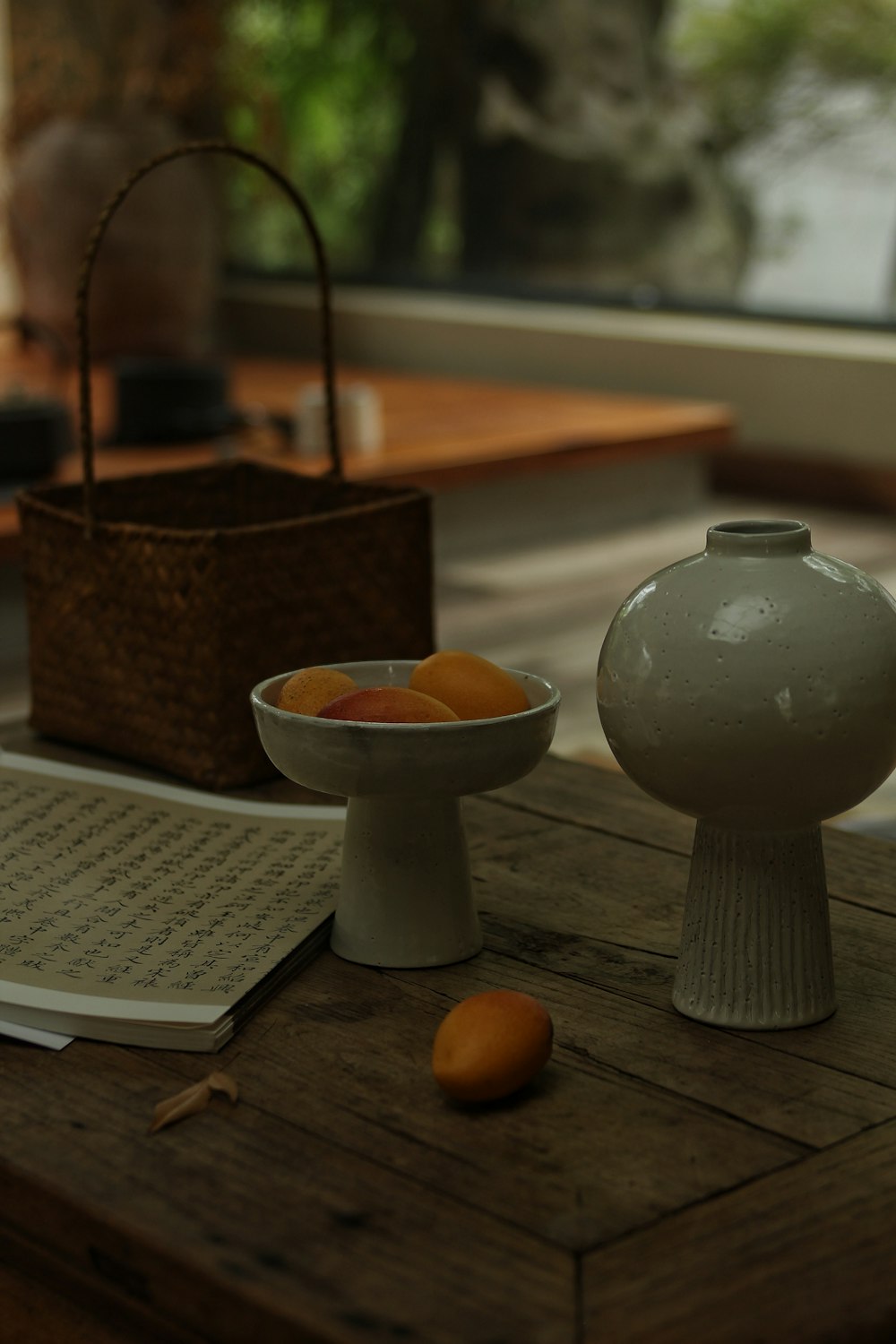 white ceramic bowl on brown wooden table