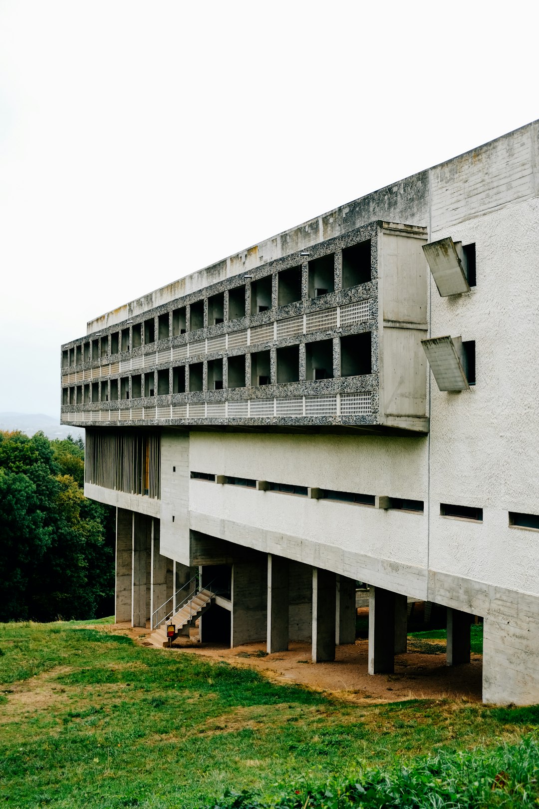 white concrete building near green grass field during daytime