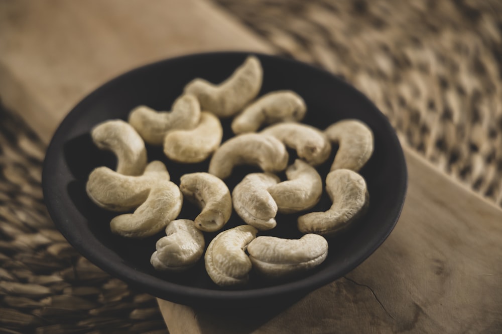 brown nuts on black round plate