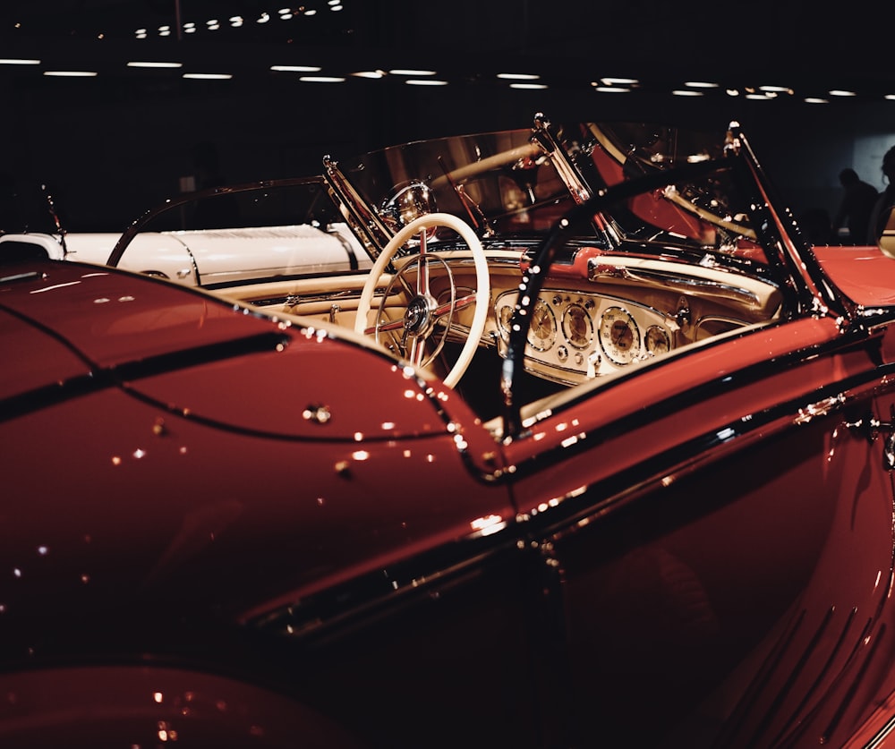 red car with black and silver steering wheel