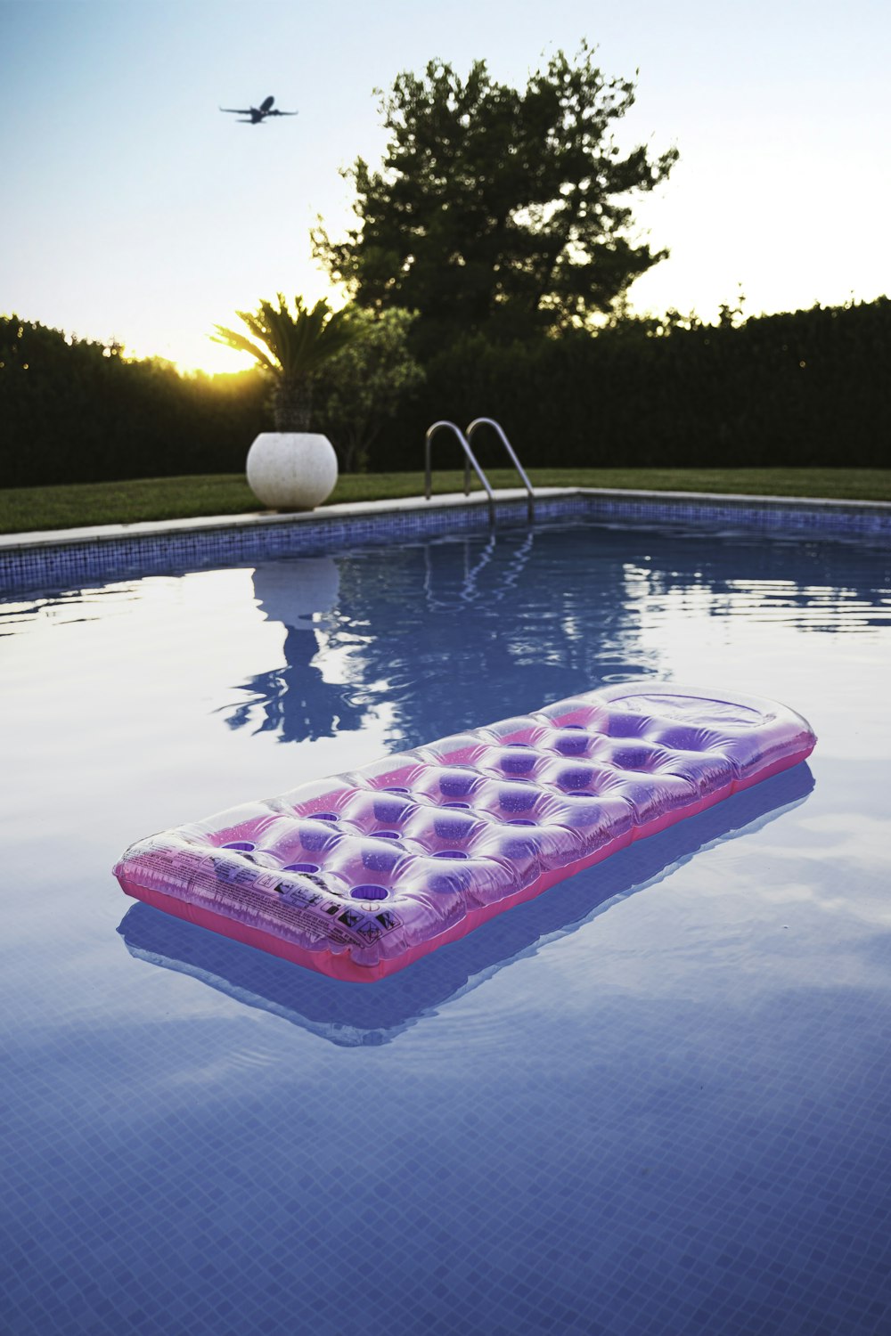 pink inflatable ring on swimming pool