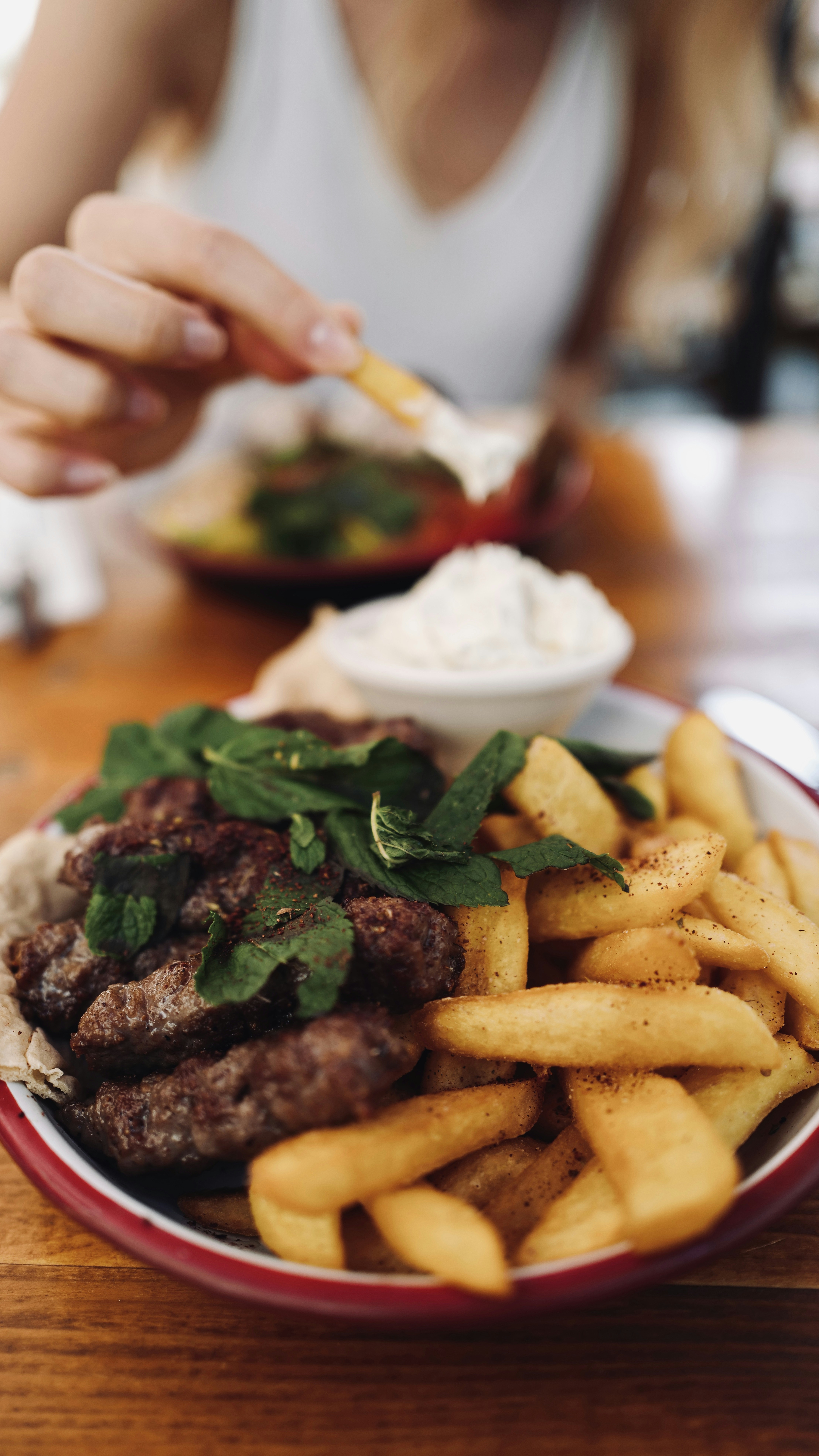 great photo recipe,how to photograph eat cig köfte in munich with fries; burger and fries on plate