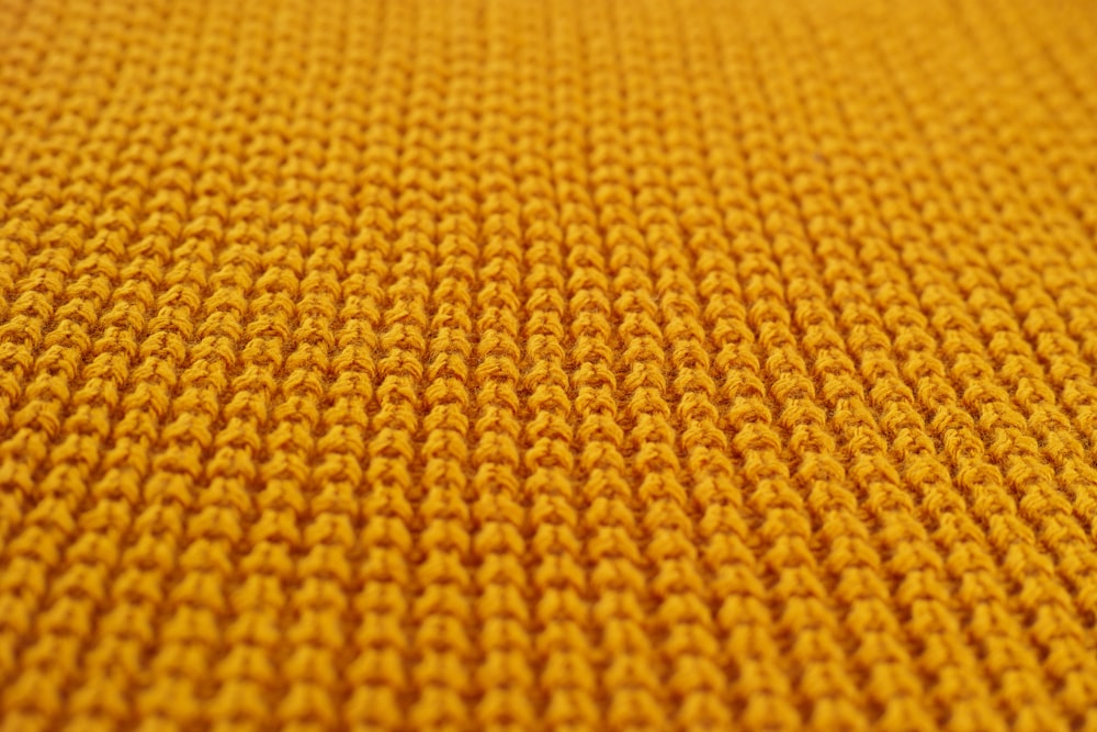 têxtil amarelo na fotografia de perto