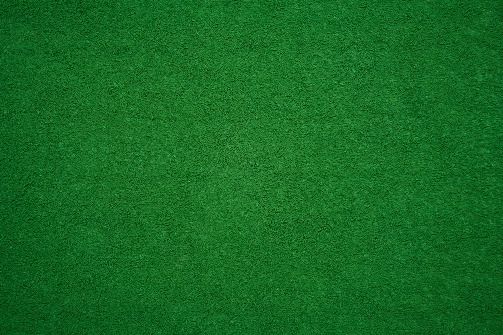 Felt dark green soft rough textile material background texture close