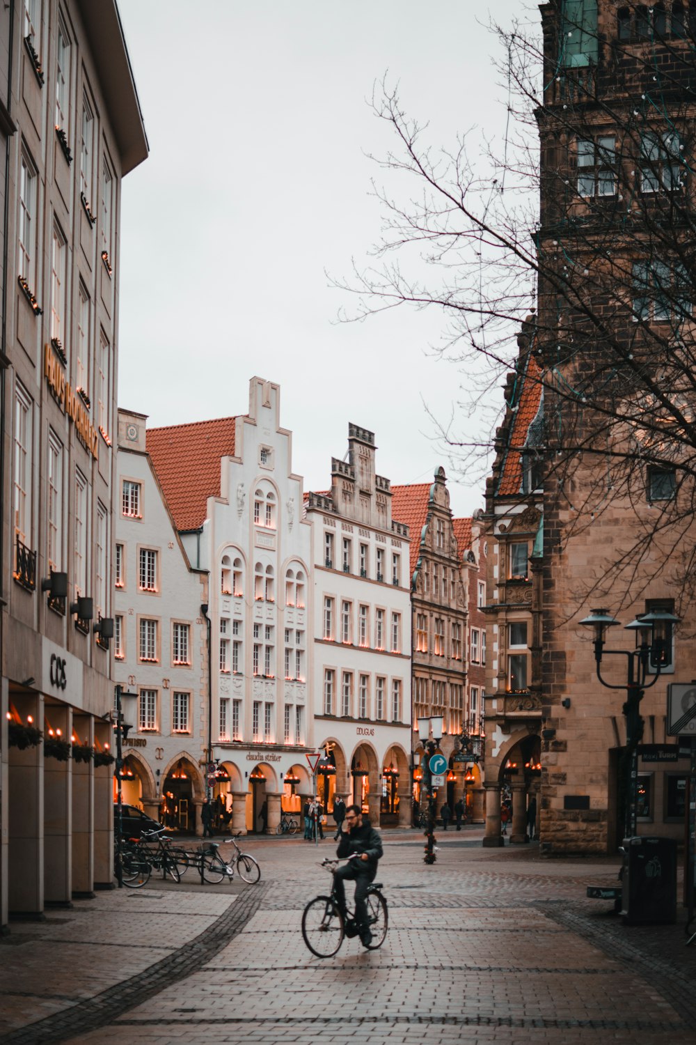 people walking on street near high rise buildings during daytime