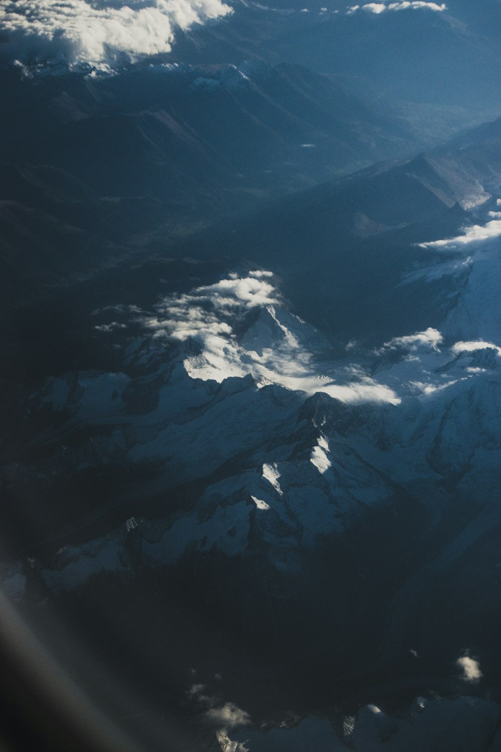 black and white mountains under blue sky