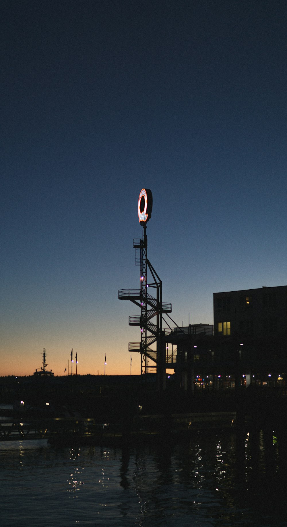 silhouette of street light during night time