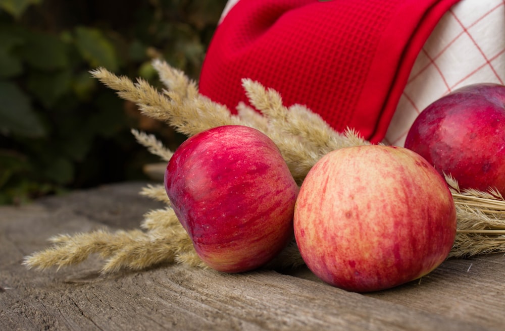 red apple fruit on brown wooden table