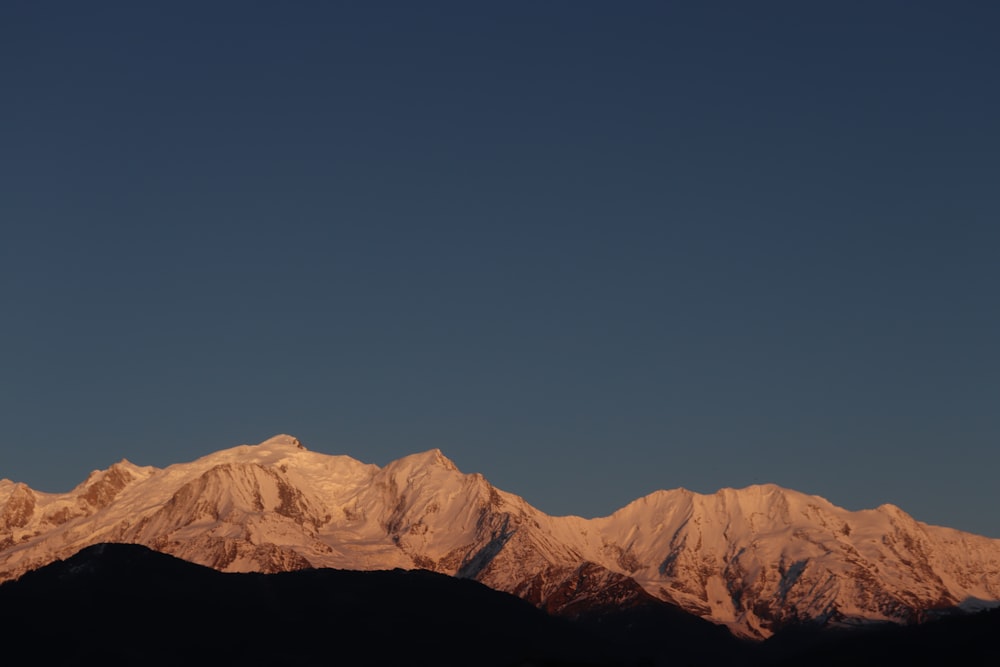 brown mountain under blue sky