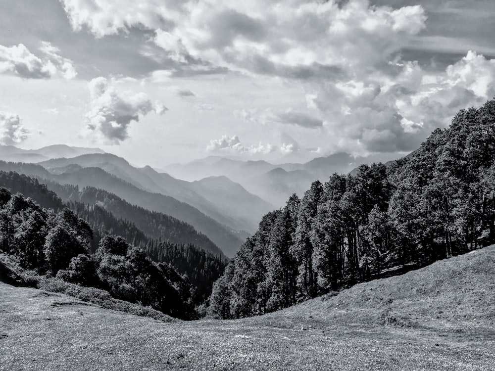 snow covered mountain under cloudy sky during daytime