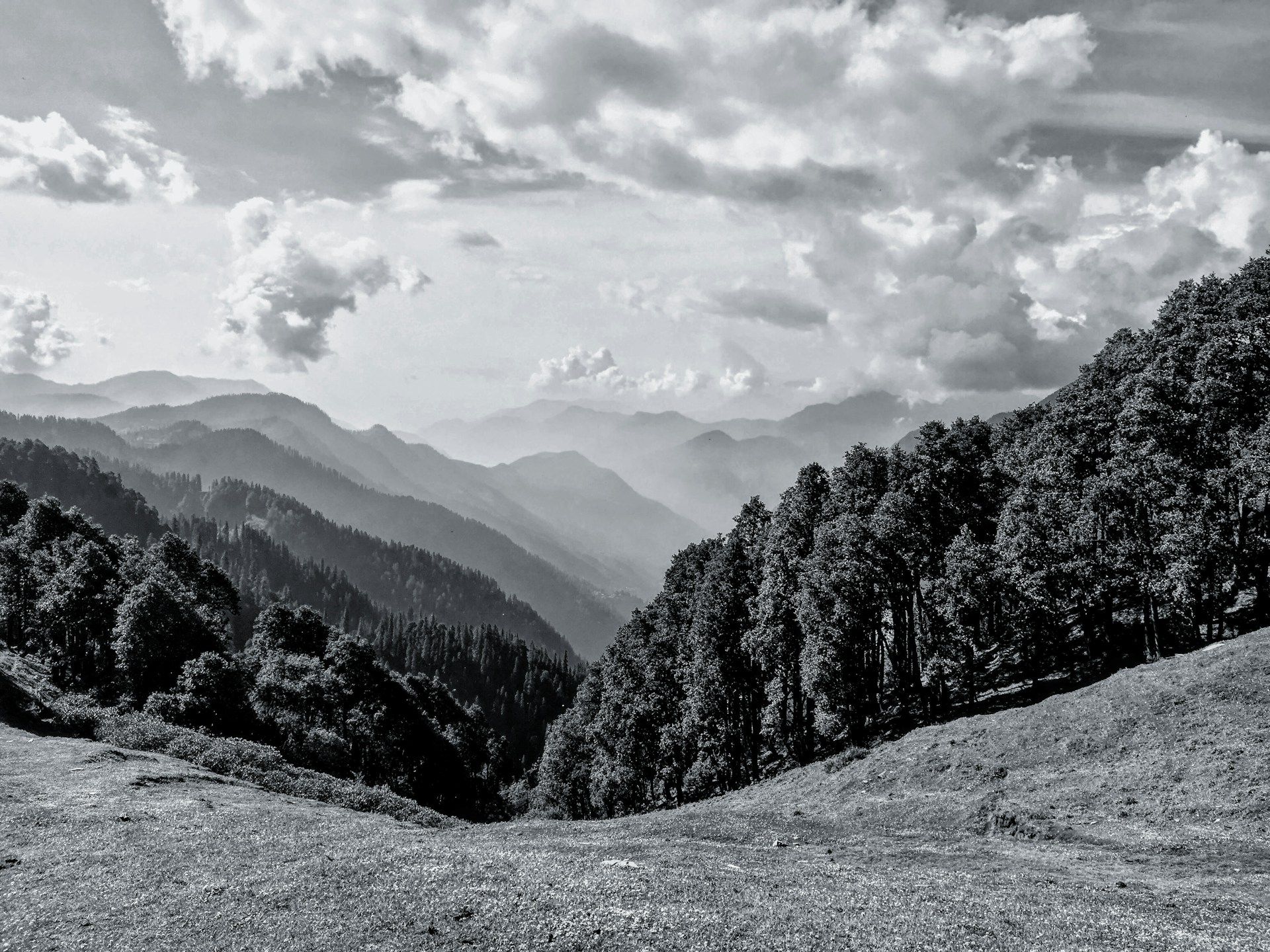 snow covered mountain under cloudy sky during daytime