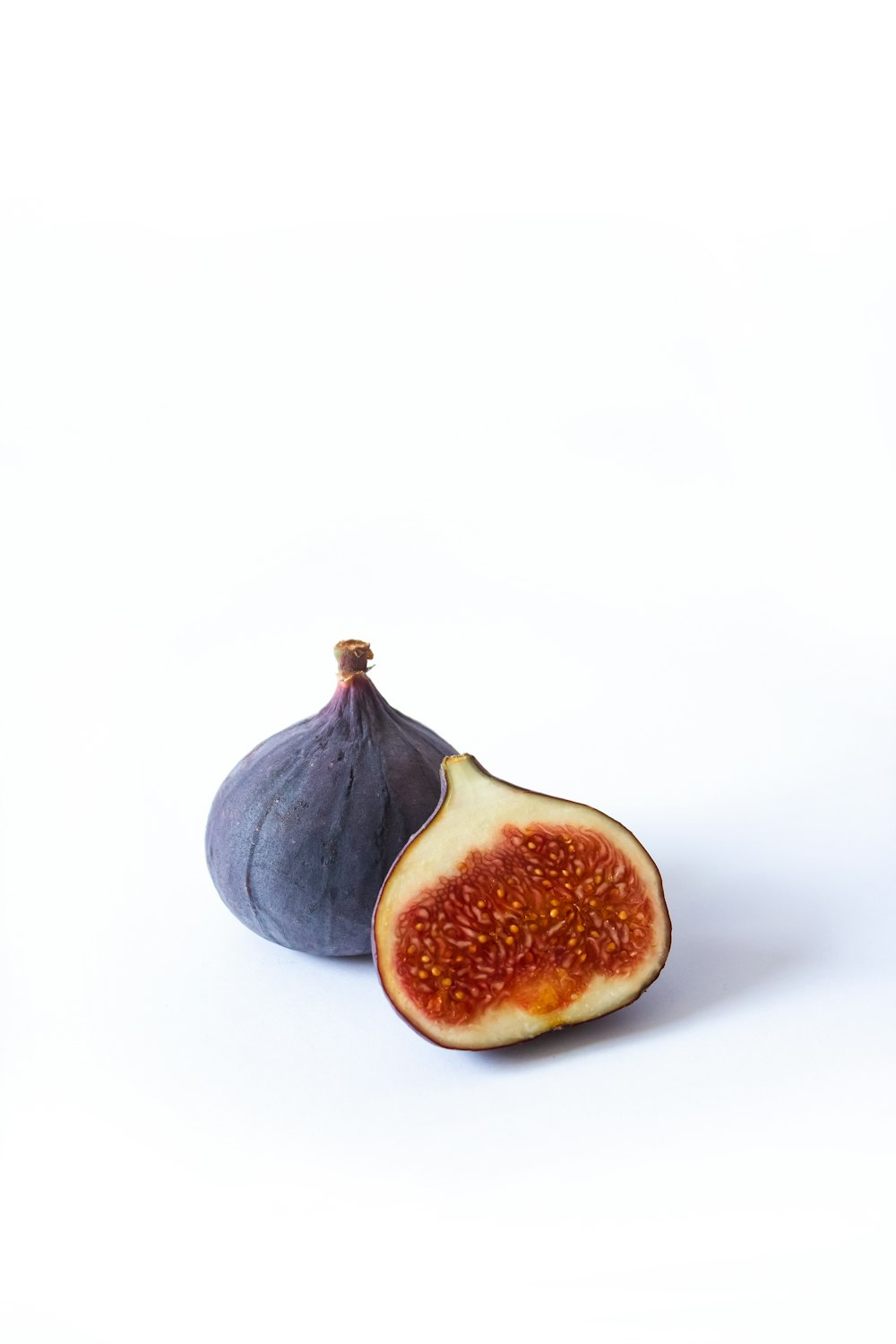 black round fruit on white background