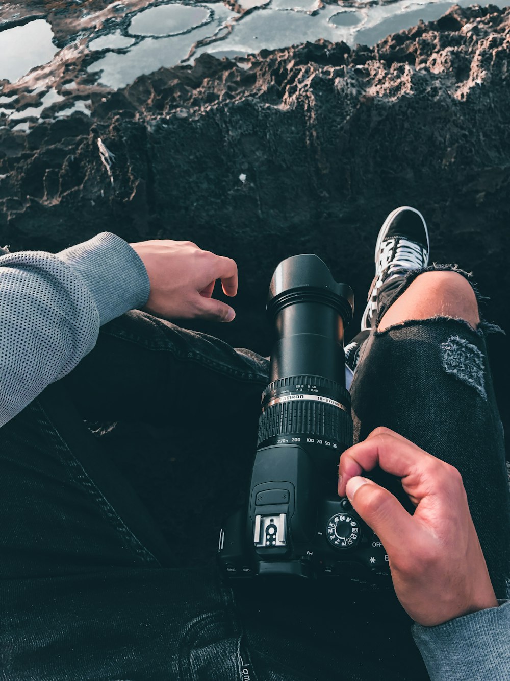 person holding black dslr camera