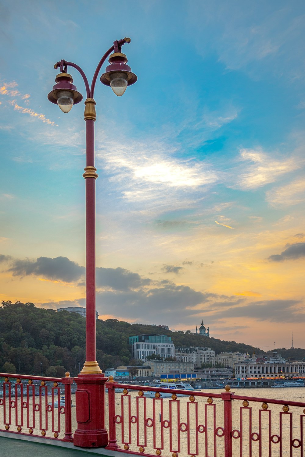 red and white street light near city buildings during daytime