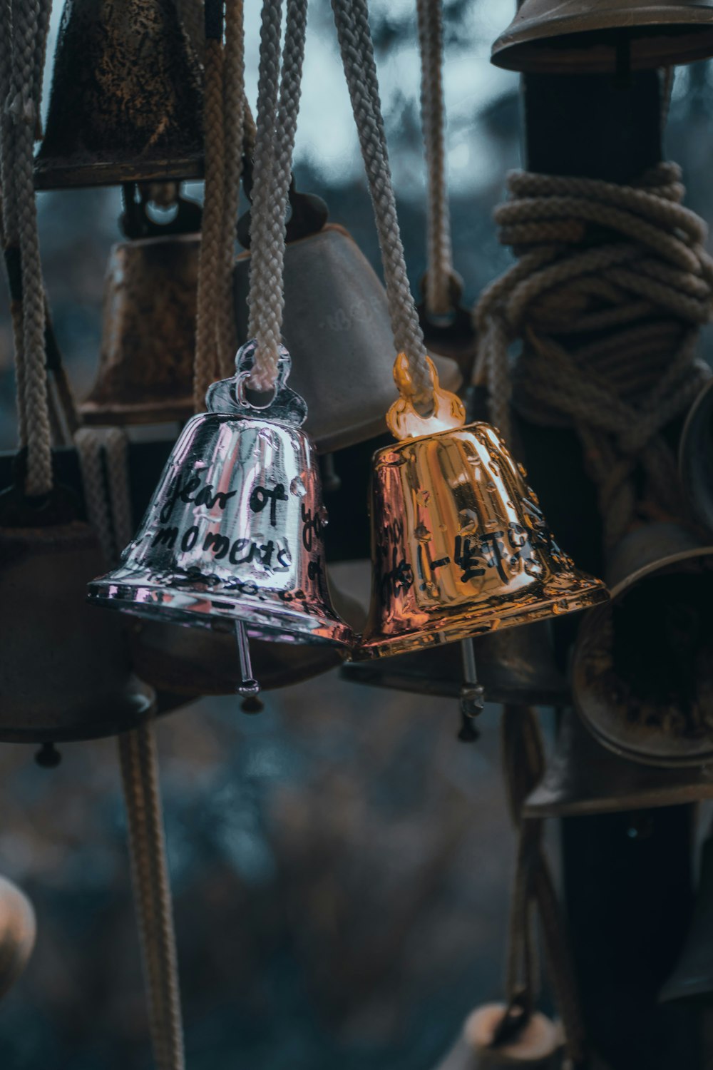 gold bell on black metal rack