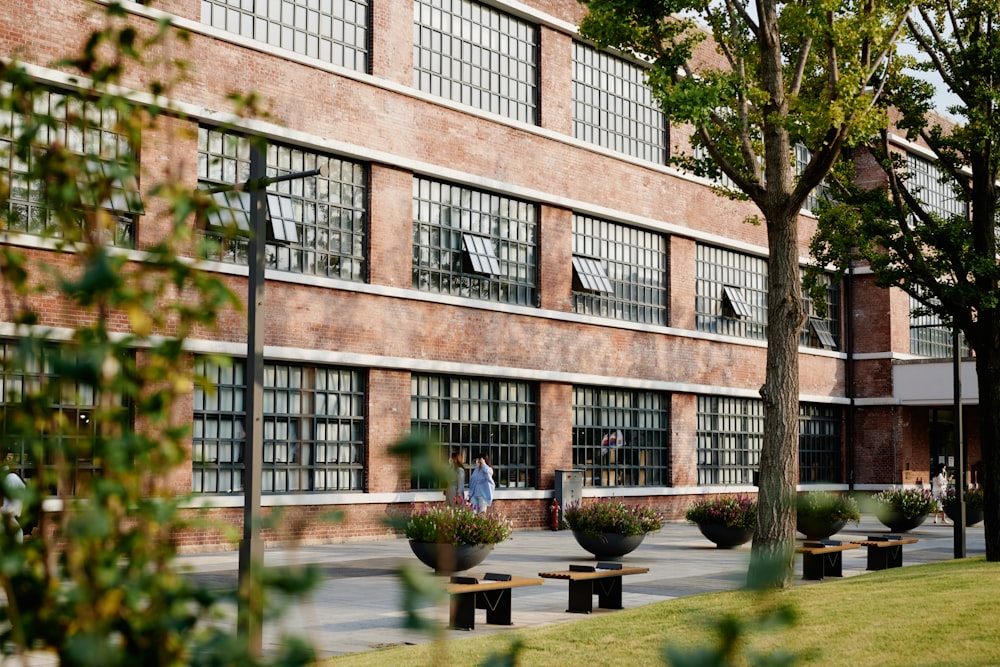 brown concrete building near green trees during daytime