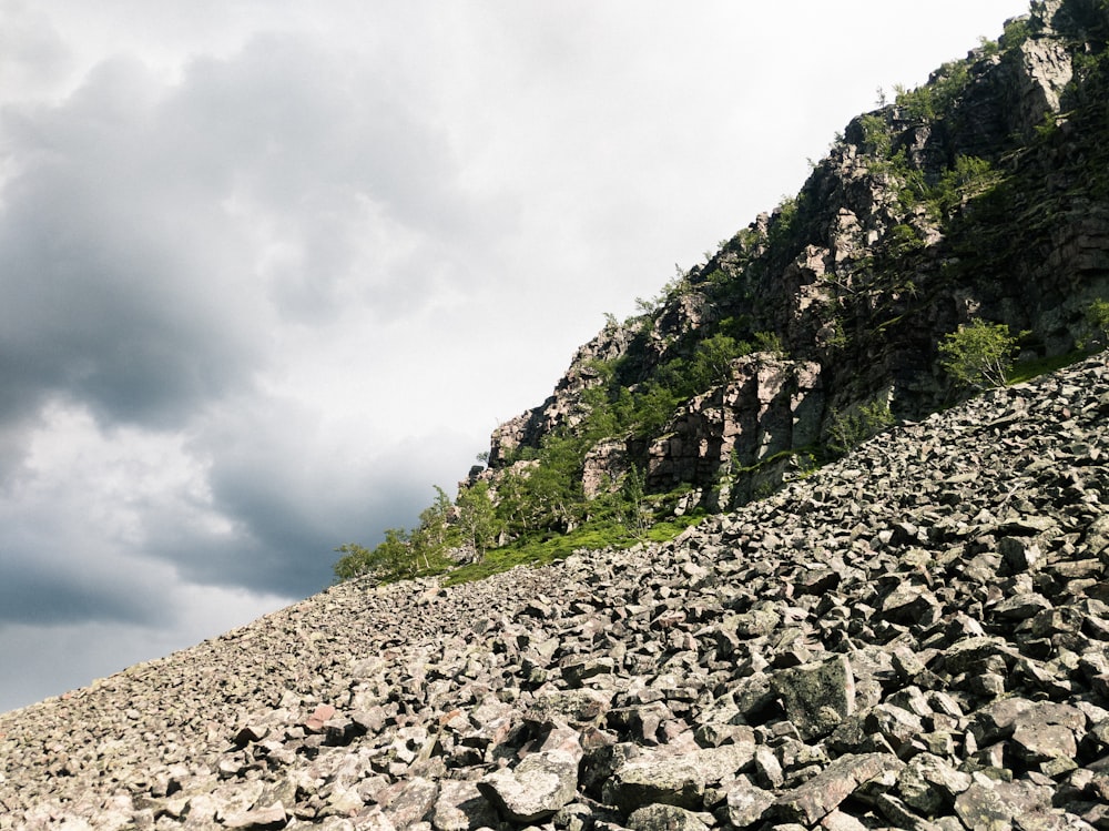 rocky mountain under cloudy sky during daytime