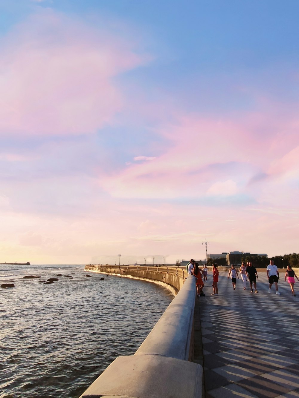 people walking on beach during daytime