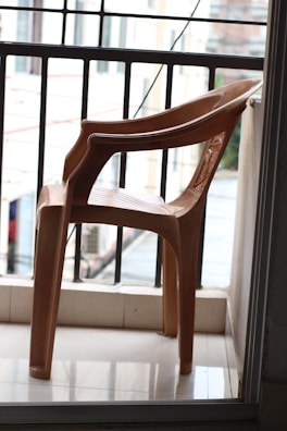A peaceful balcony space with chairs overlooking the quiet neighborhood.