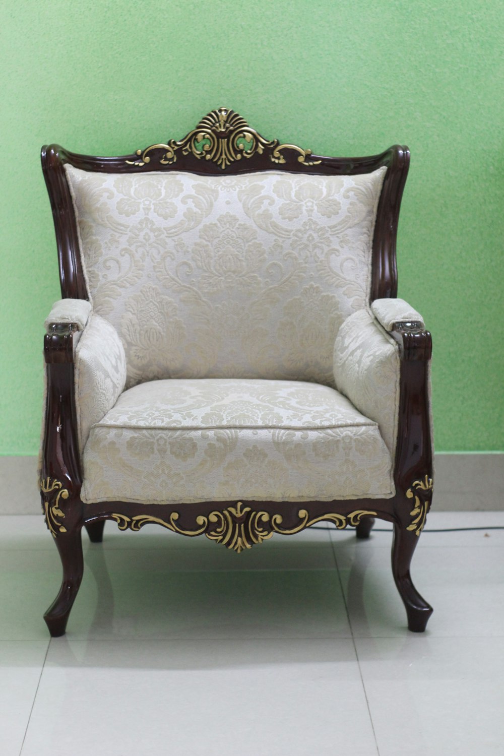 white and brown floral armchair