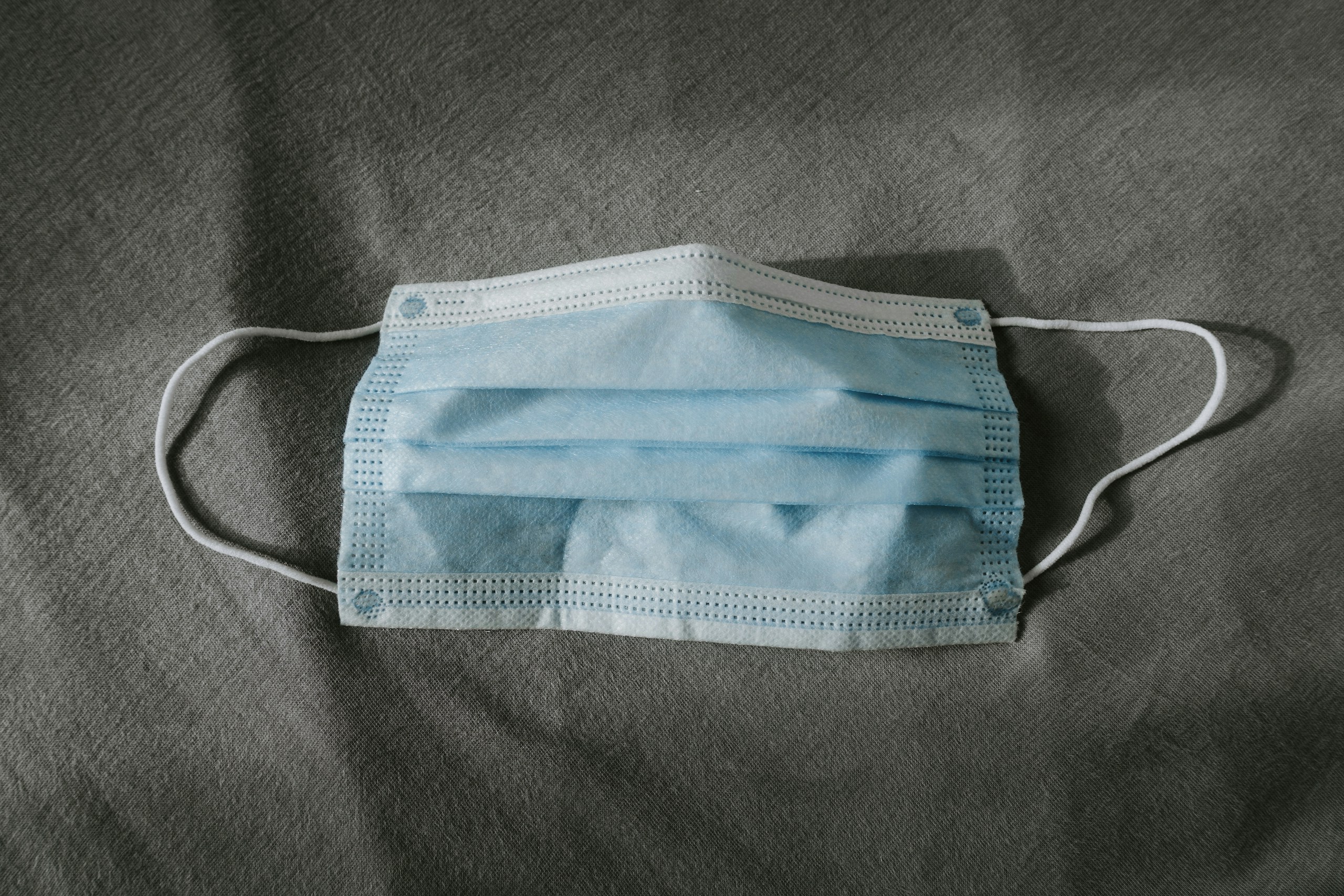 teal and white underwear on gray textile